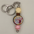 Llavero Beige Rosa "Stay Groovy"