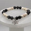 Pulsera con dije de timón de piedra Picasso de magnesita