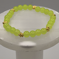 Pulsera de Cristal Verde Amarillento con Separadores de Estrellas Doradas