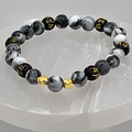 Pulsera Pixiu de Magnesita Negra con Separadores de Estrella Dorados