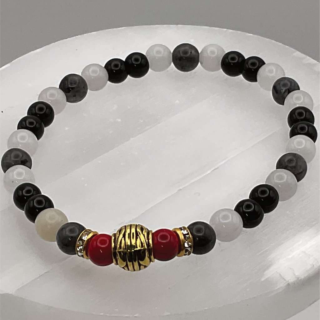 Pulsera de Cuarzo Lechoso y Ágata Negra con Espaciador Tono Oro
