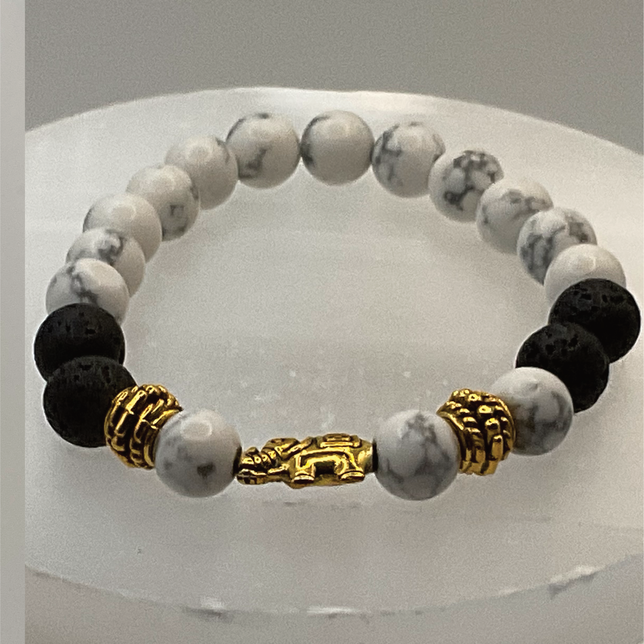 Howlite Lava Elephant Charm Bracelet with Gold Tone Spacers