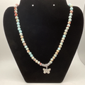 18" Calcite Butterfly Charm Necklace with Silver Tone Barrel Spacers