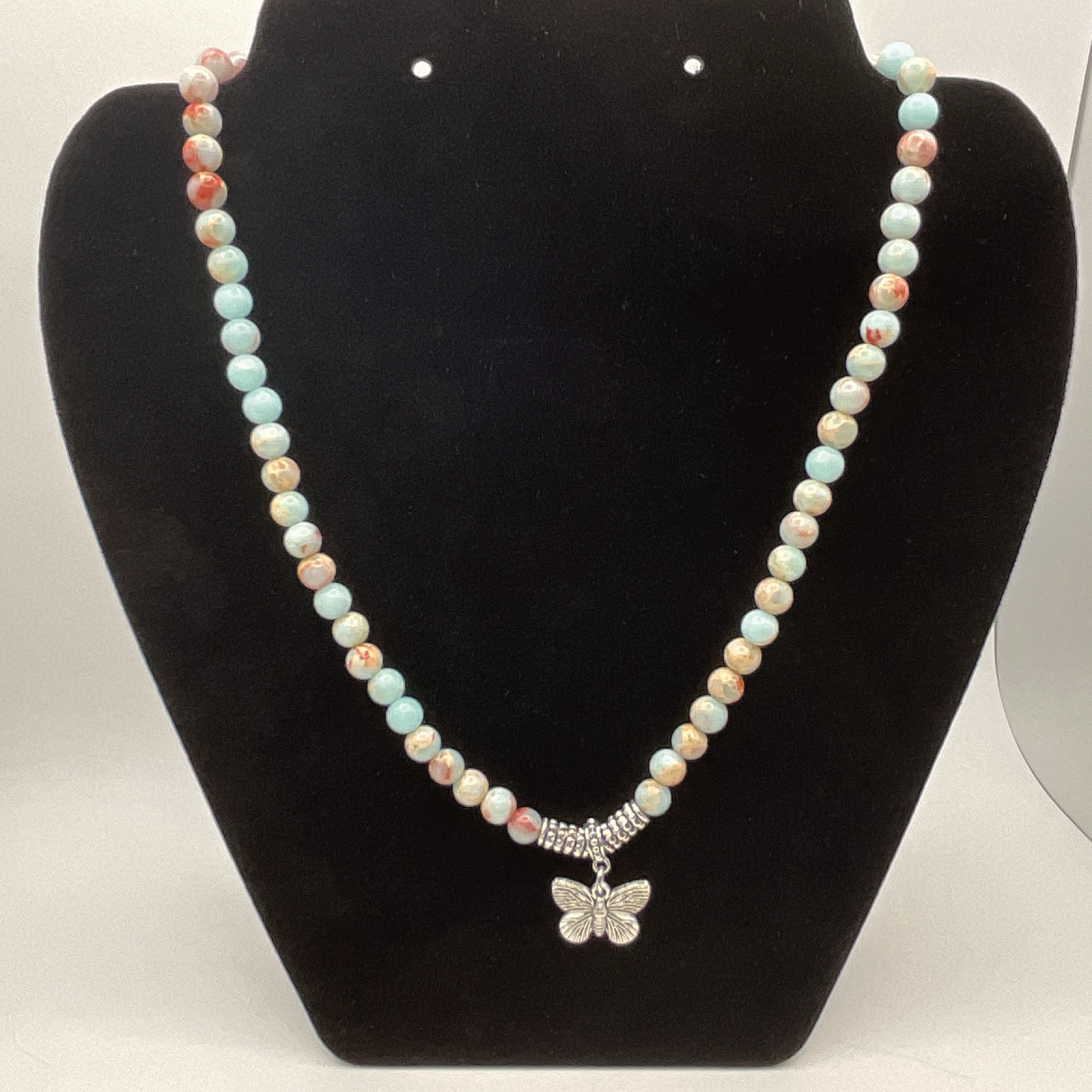 18" Calcite Butterfly Charm Necklace with Silver Tone Barrel Spacers