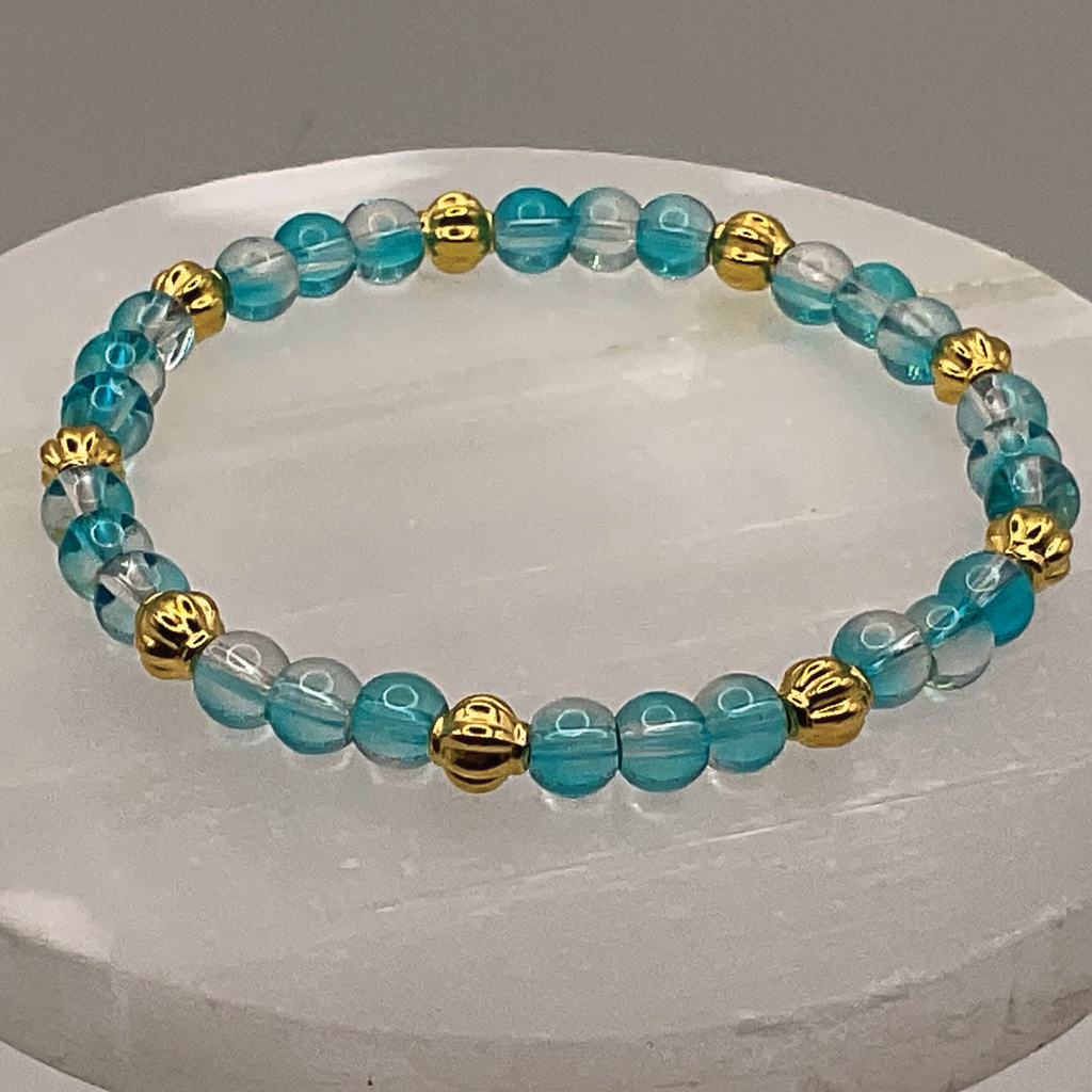 Clear Blue Glass Bracelet with Gold Lobed Spacers