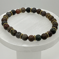 Picasso Stone Bracelet with Gold Disc Spacers