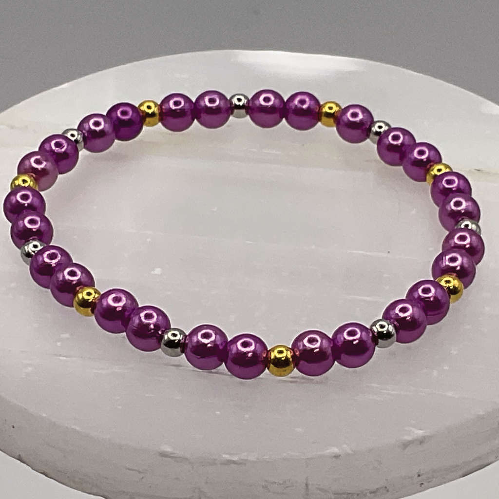 Pulsera de cristal morado con separadores dorados y plateados