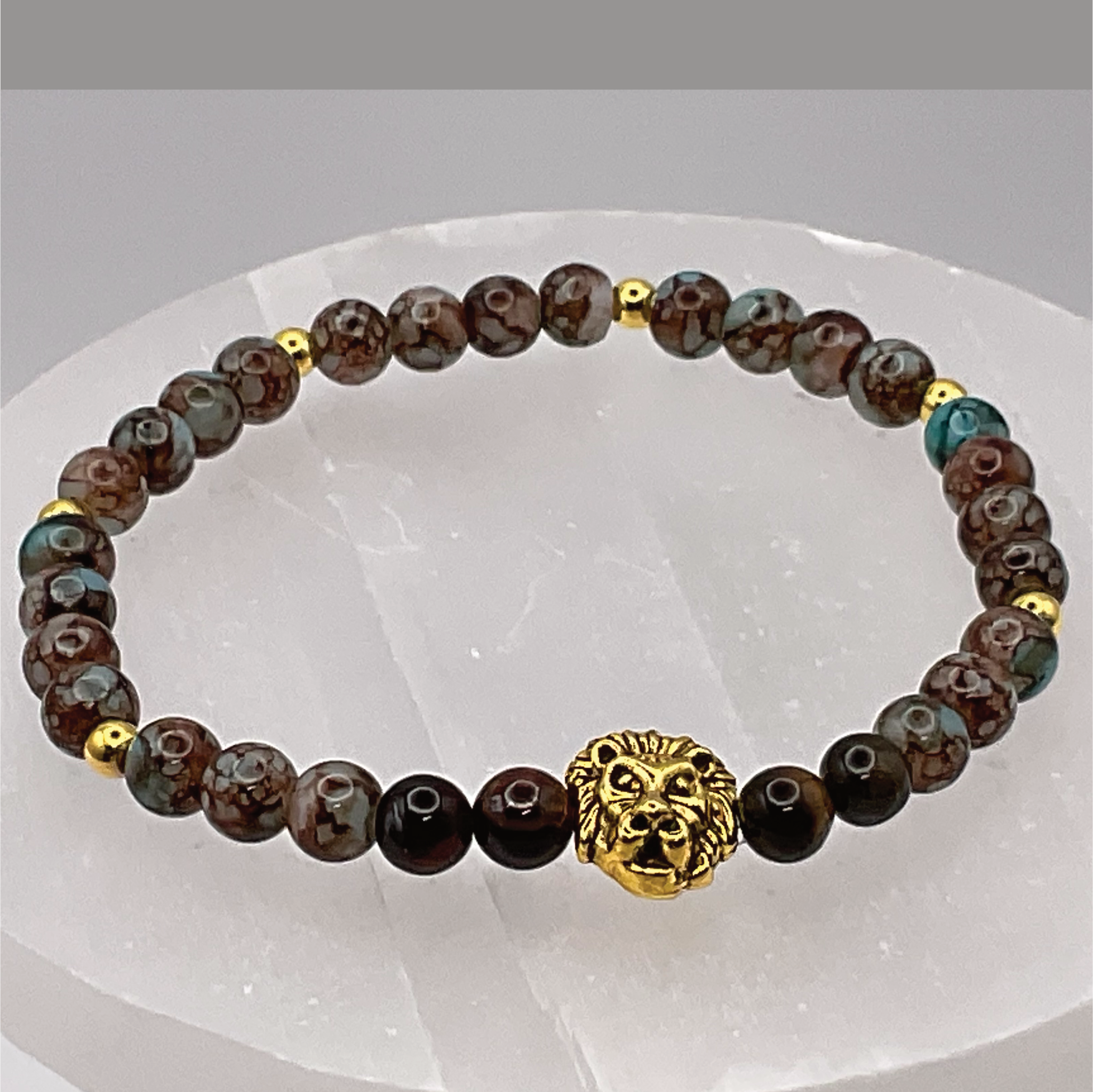 Blue Howlite Lion Charm Bracelet with Gold Tone Spacers