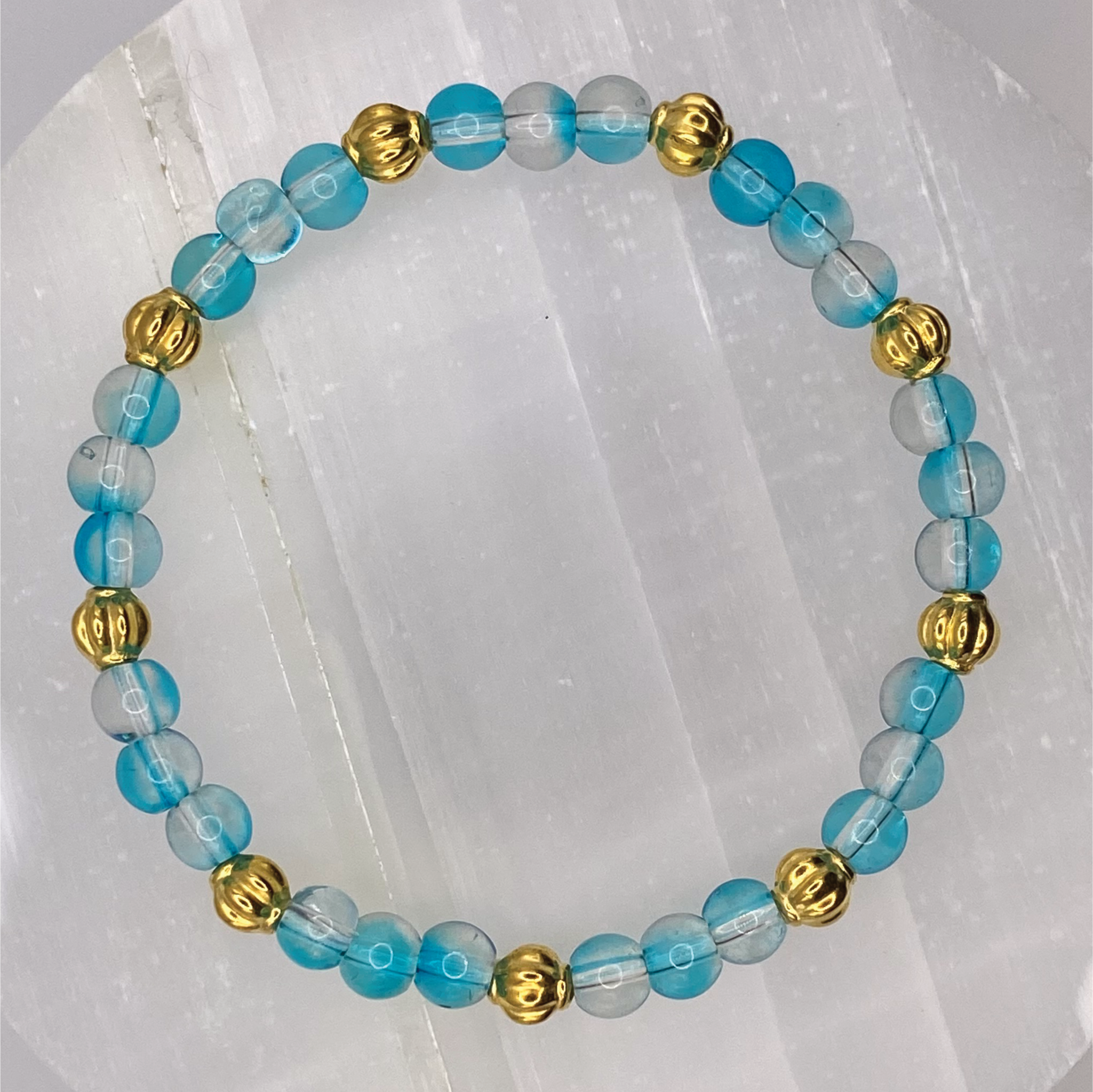 Clear Blue Glass Bracelet with Gold Lobed Spacers