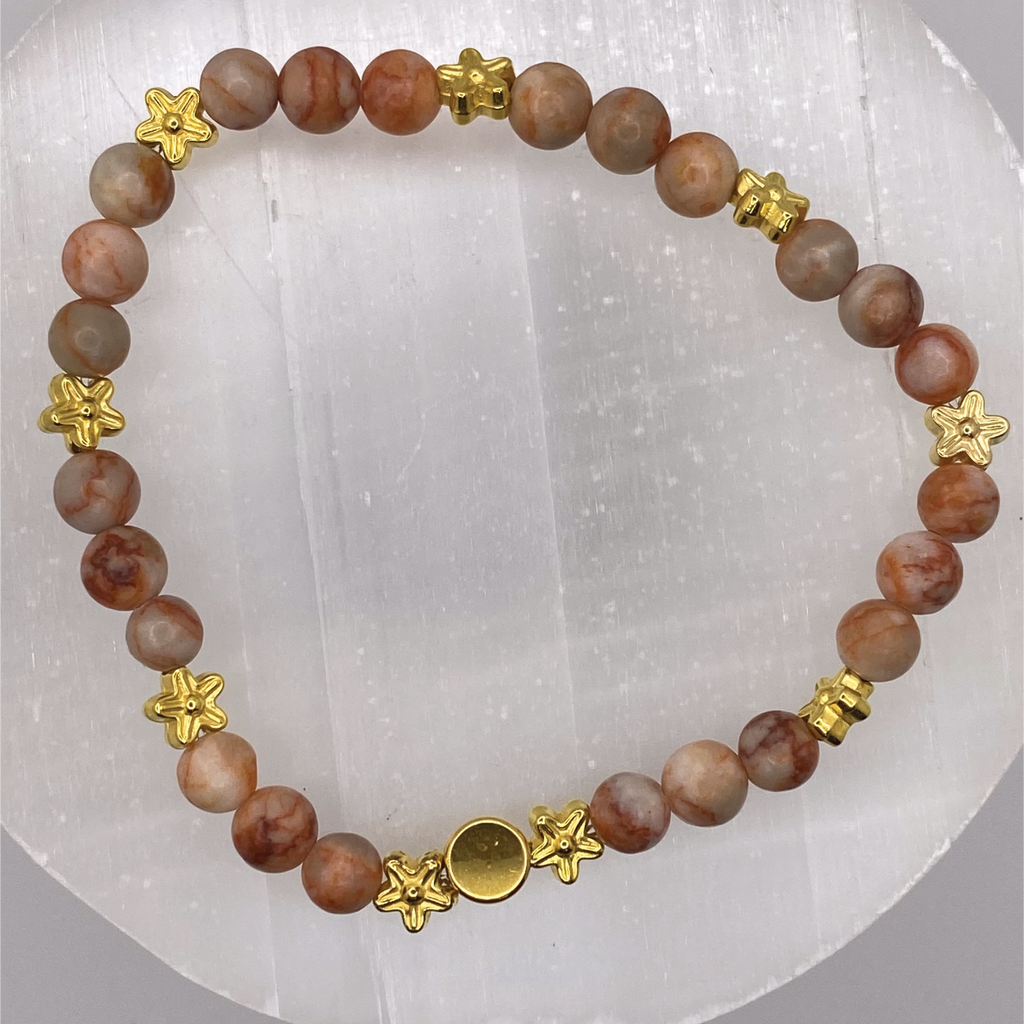 Red Vein Jasper Bracelet with Gold Tone Star and Disc Spacers