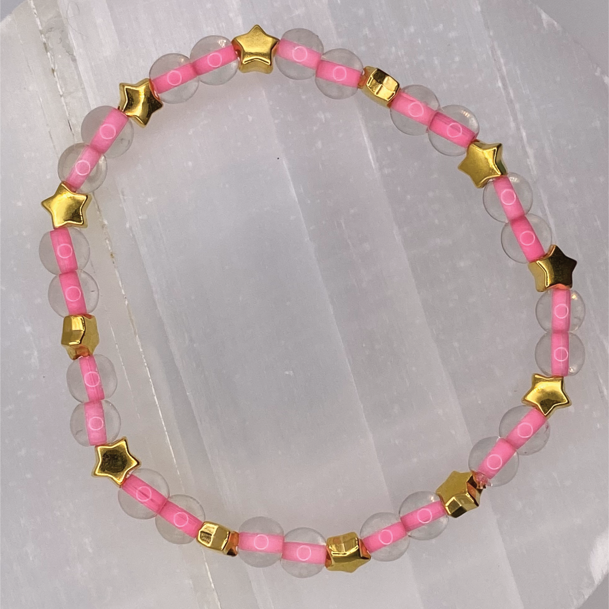 Clear Lined Pink Glass Bracelet with Gold Star Spacers
