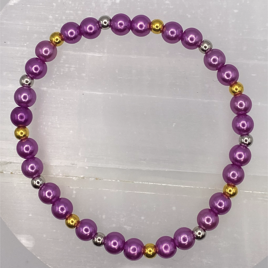 Pulsera de cristal morado con separadores dorados y plateados