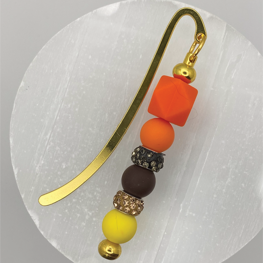 Marcapáginas naranja, marrón y amarillo