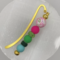 Marcador de páginas de leopardo rosa y verde