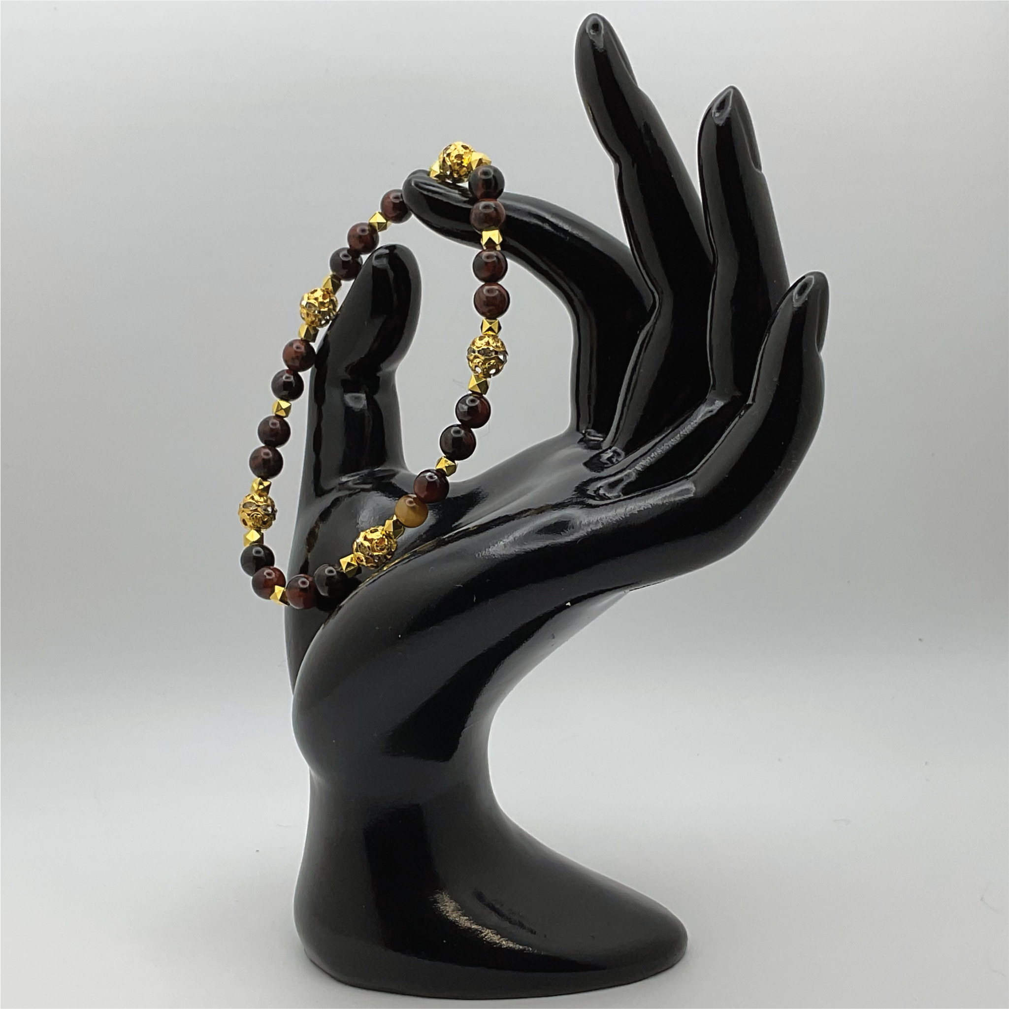Pulsera de obsidiana caoba con espaciadores dorados