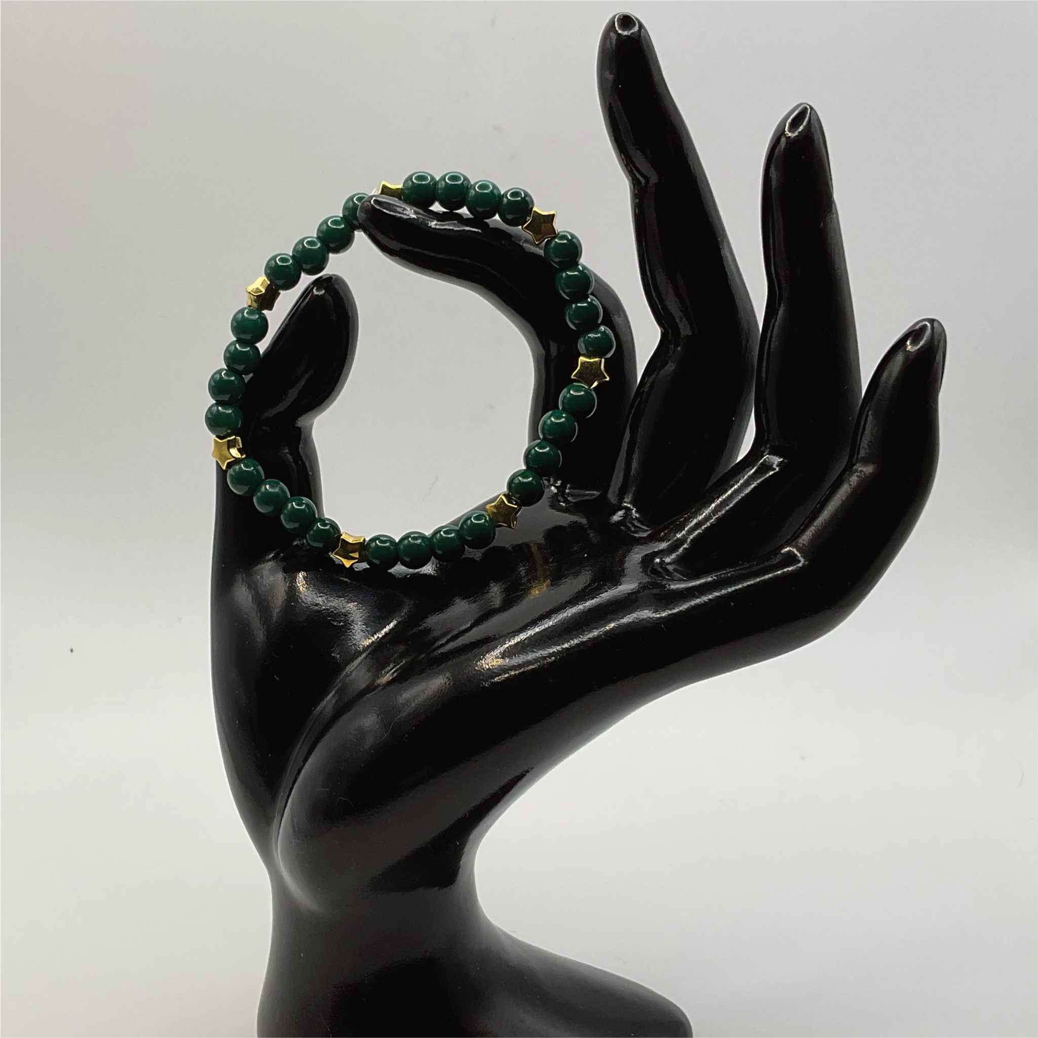 15 cm (5.9") Dark Green Glass Bracelet with Gold Star Spacers