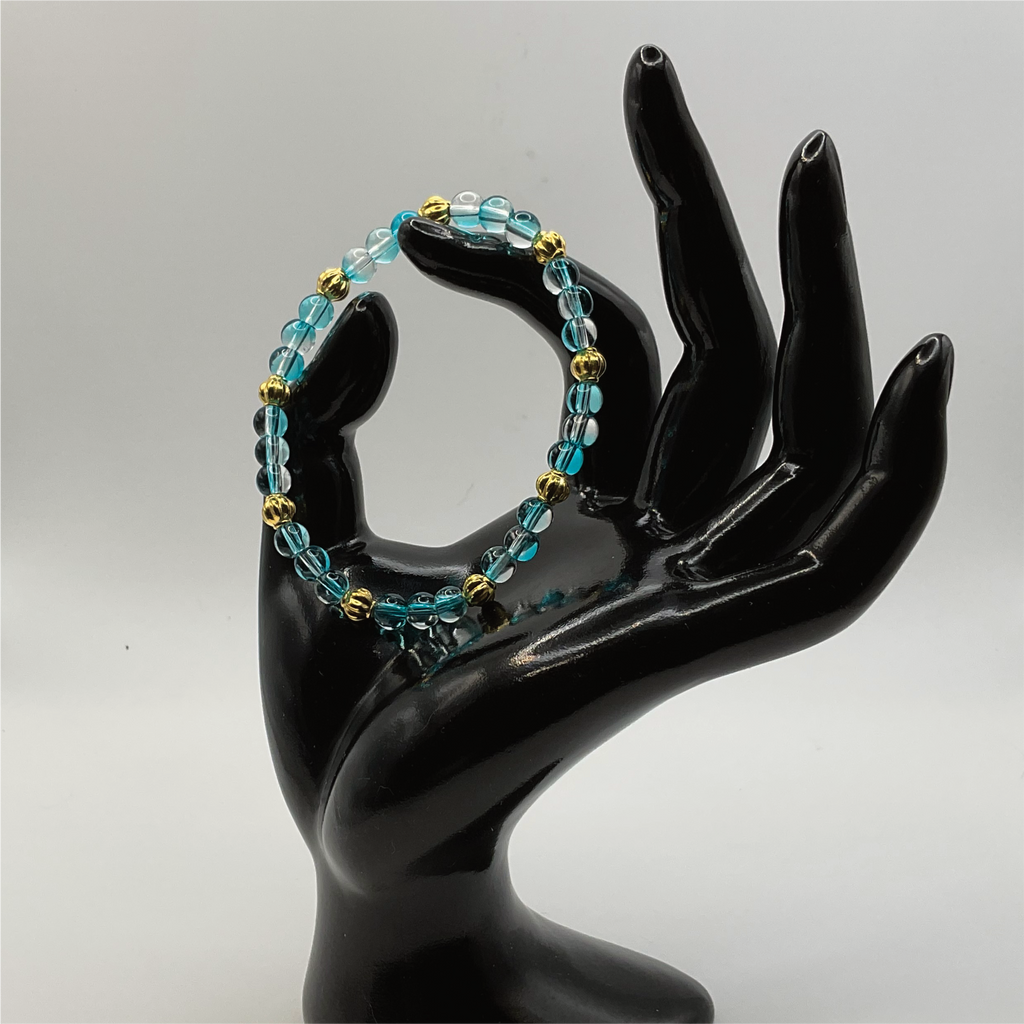 Clear Blue Glass Bracelet with Gold Lobed Spacers