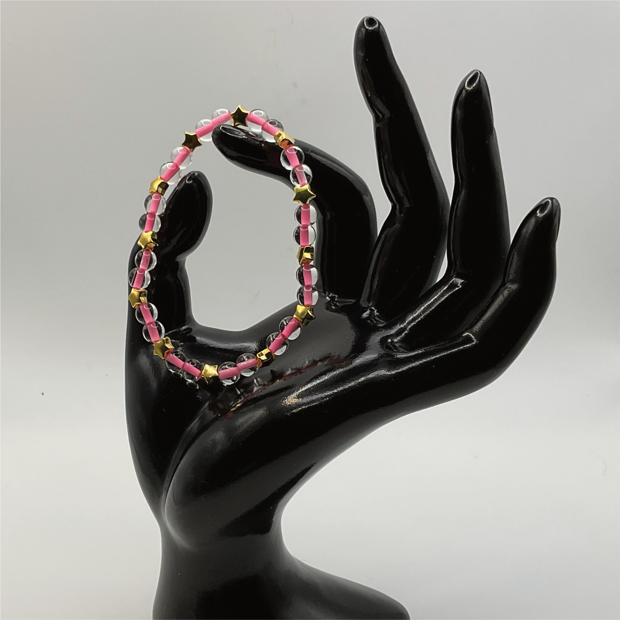 Clear Lined Pink Glass Bracelet with Gold Star Spacers