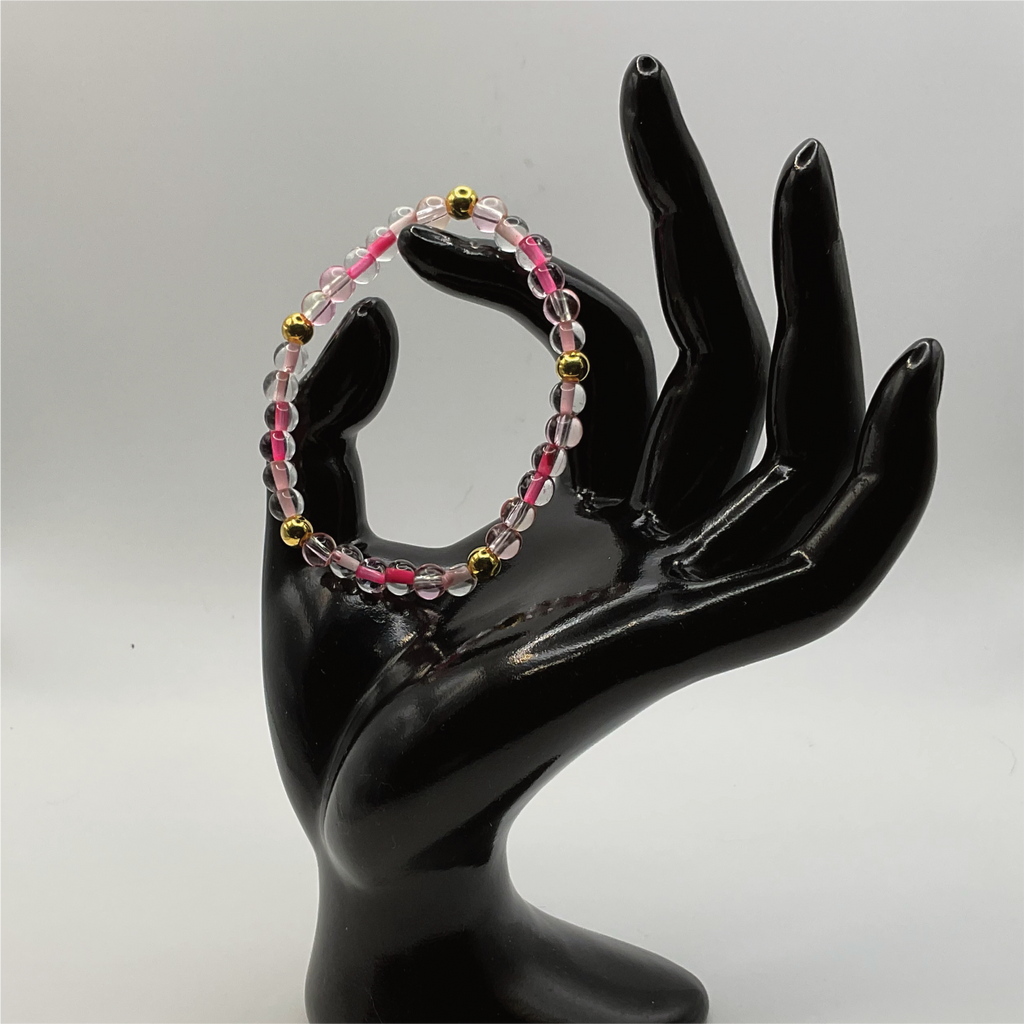 Clear Lined Pink Glass Bracelet with Gold Spacers