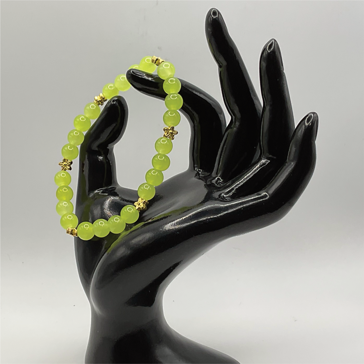 Yellowish Green Glass Bracelet with Gold Star Spacers