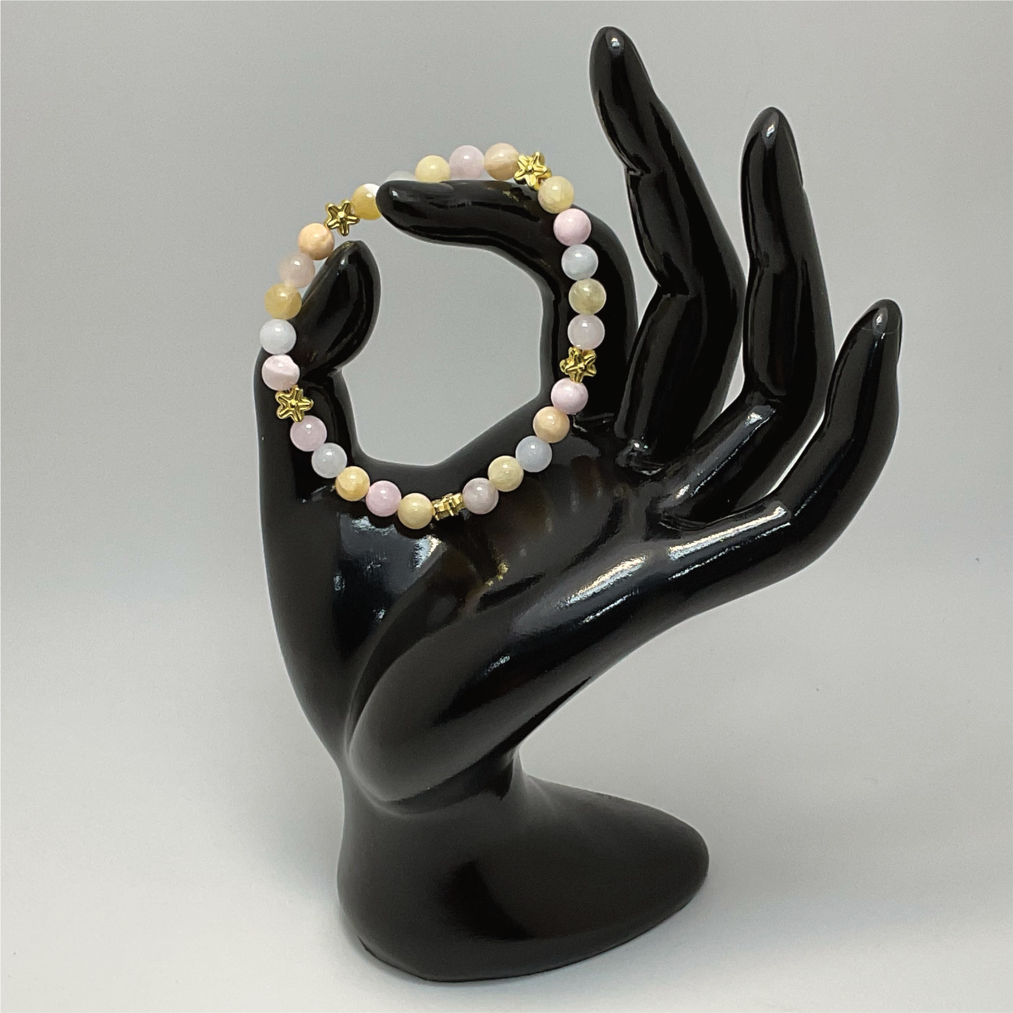Pulsera de ópalo rosa, cuarzo lechoso y citrino con espaciadores de estrella dorados