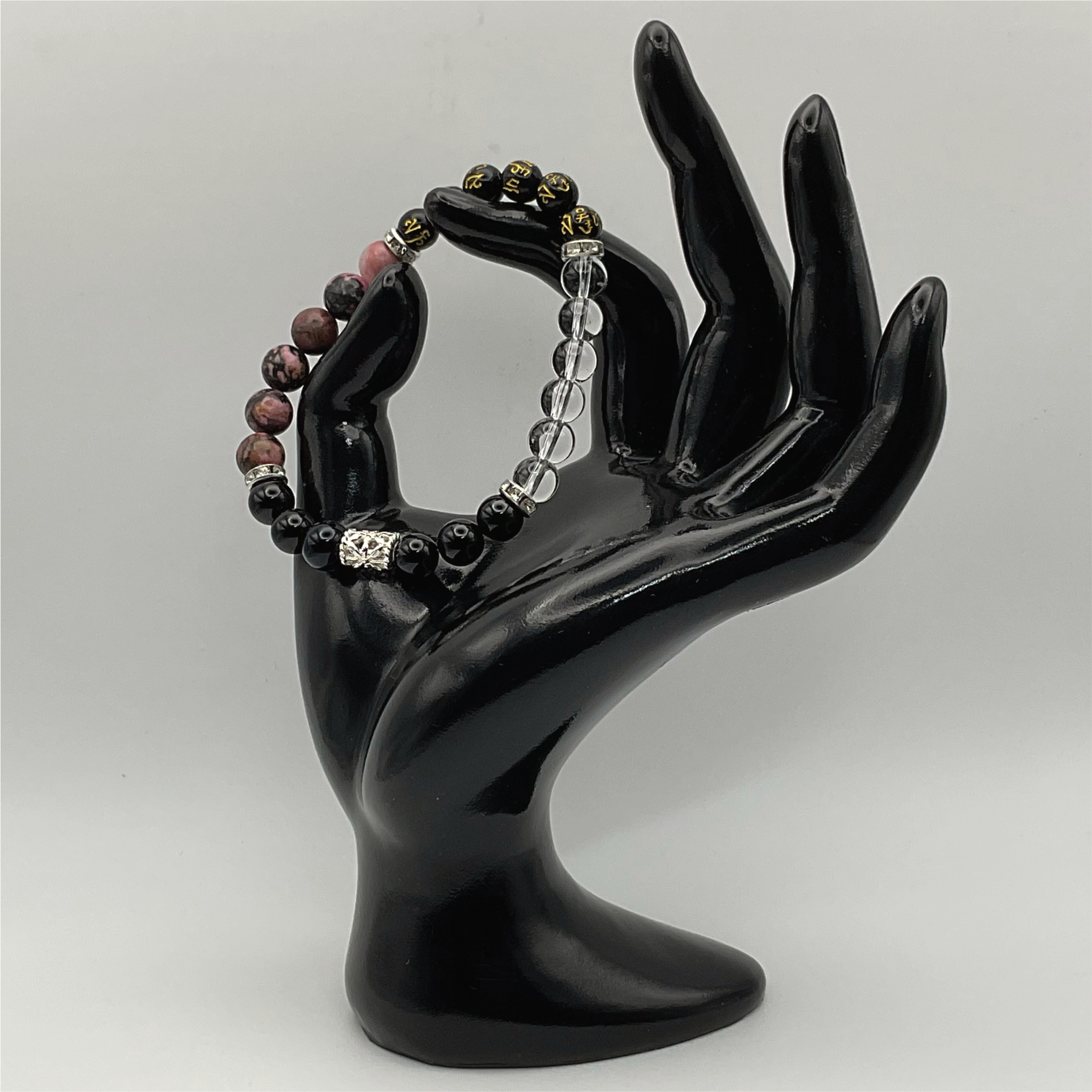 Pulsera de Cuarzo Transparente y Rodonita con Pixiu Negro y Espaciadores Tono Plata