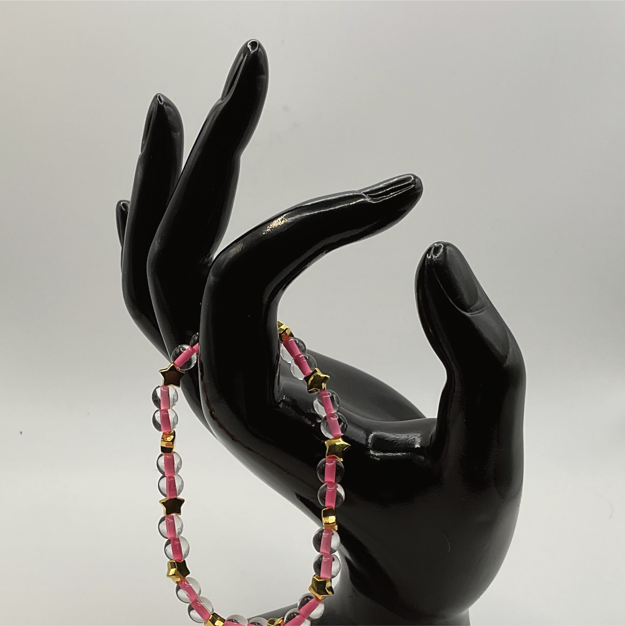 Clear Lined Pink Glass Bracelet with Gold Star Spacers