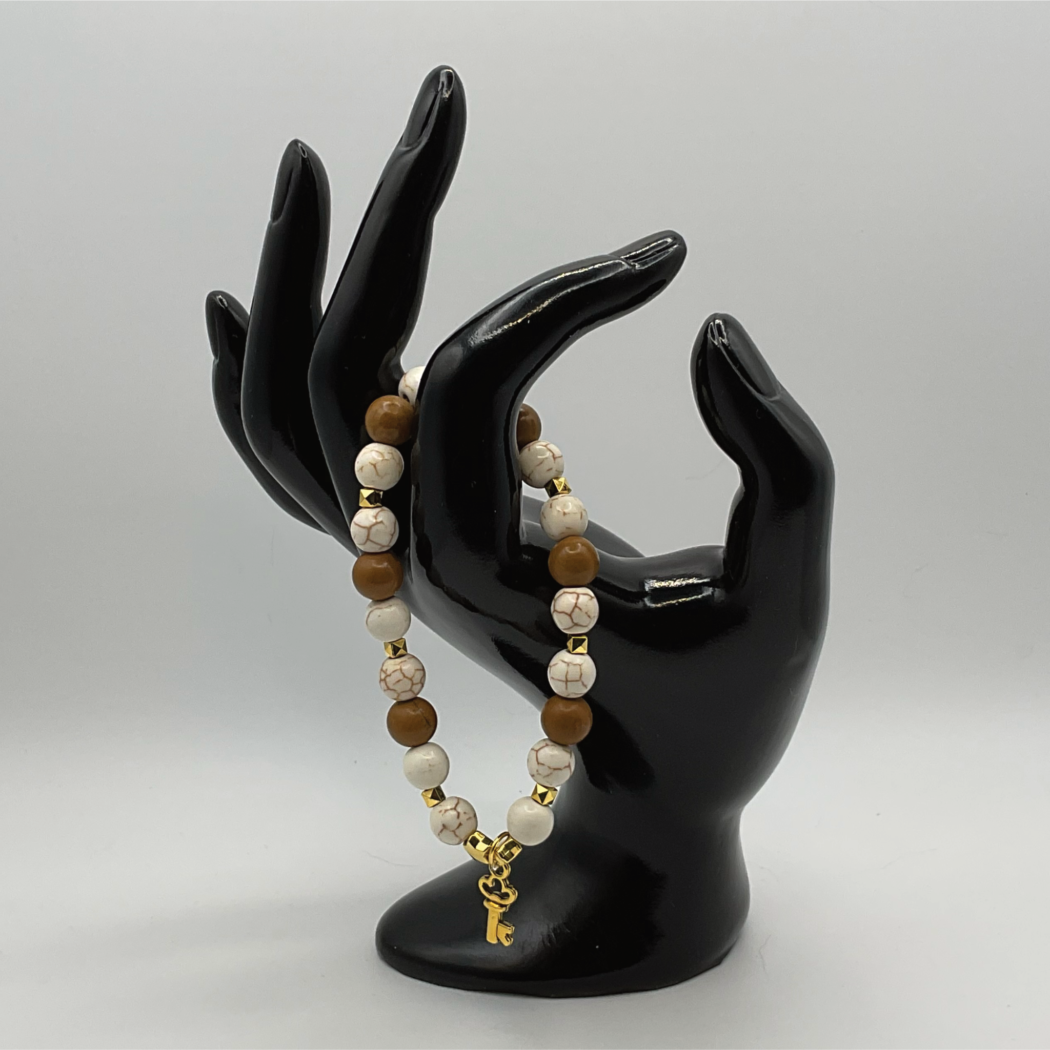 Magnesite Yellow Jasper Key Charm Bracelet with Gold Tone Spacers