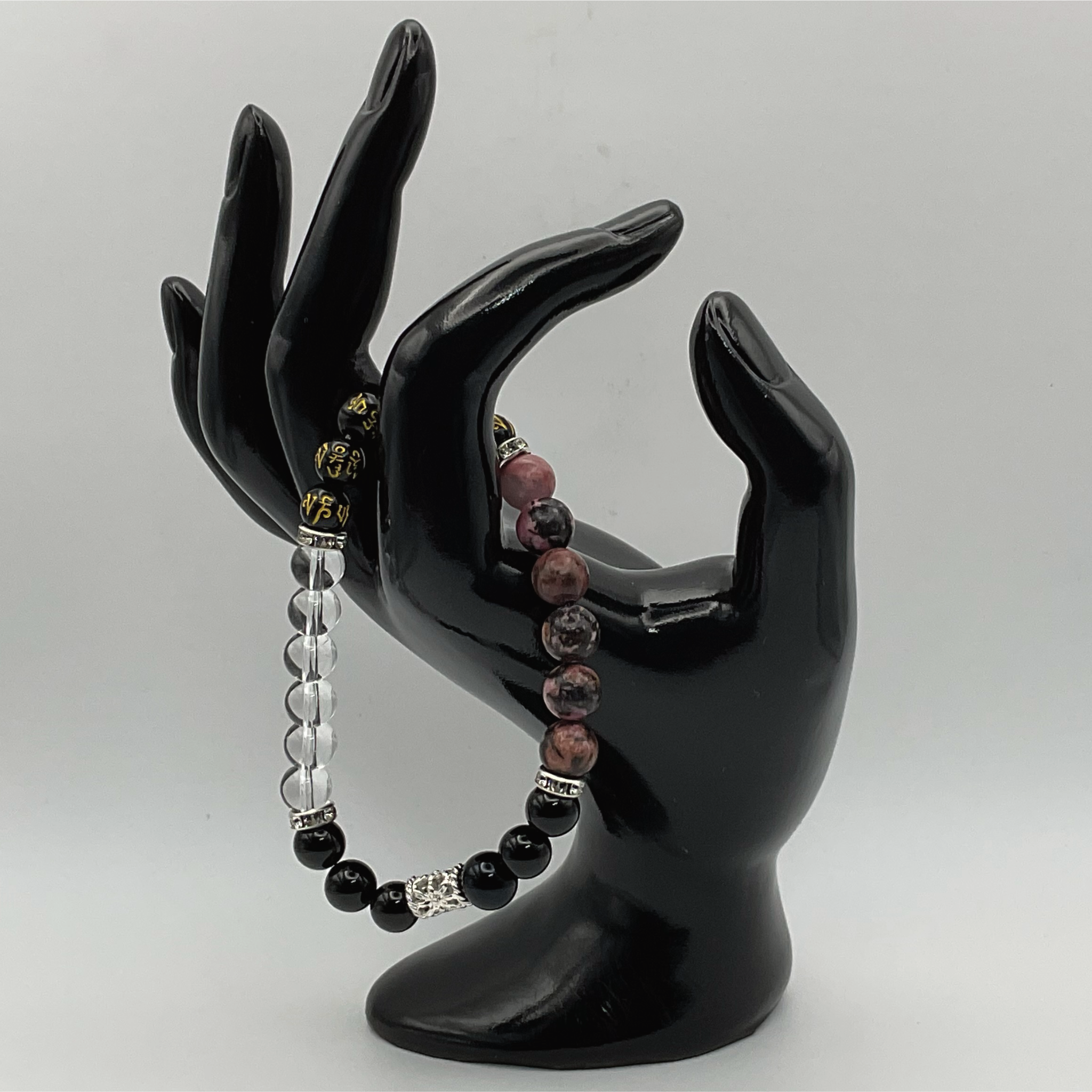 Pulsera de Cuarzo Transparente y Rodonita con Pixiu Negro y Espaciadores Tono Plata