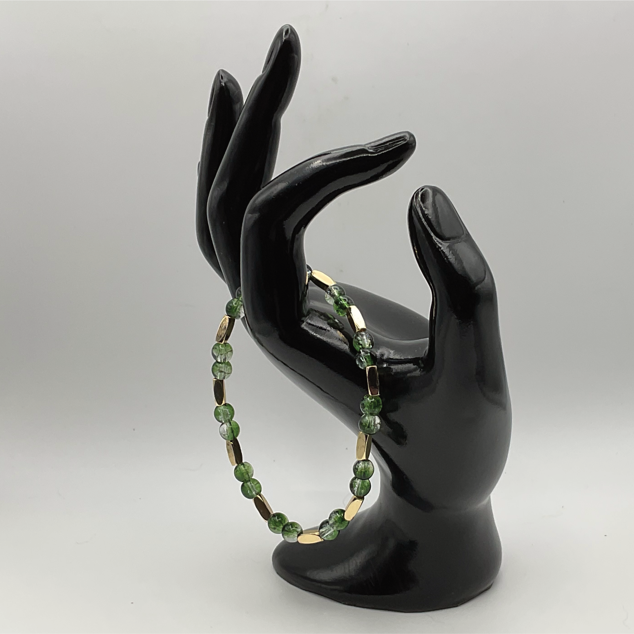 Green Glass Bracelet with Long Gold Spacers