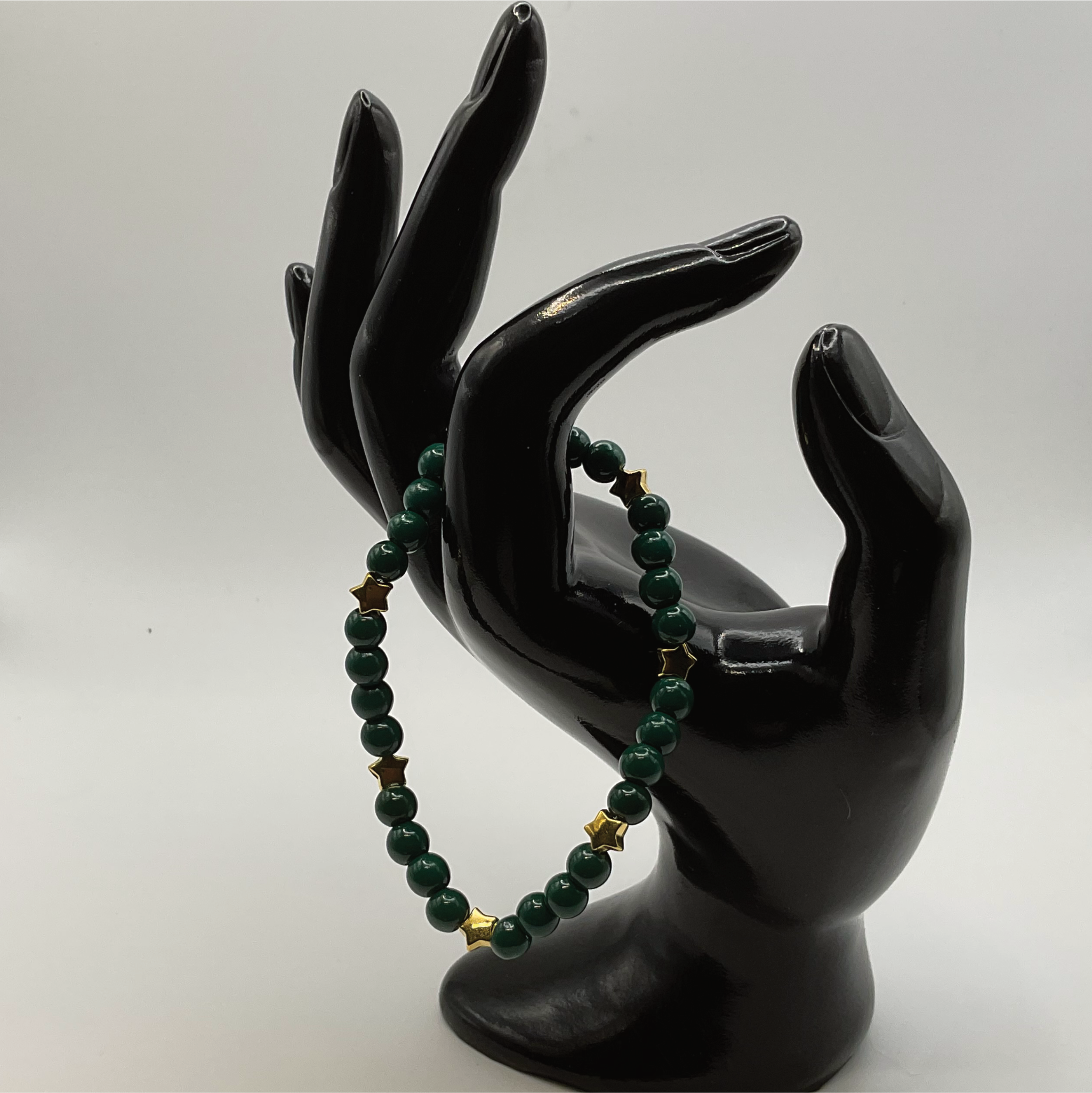 15 cm (5.9") Dark Green Glass Bracelet with Gold Star Spacers