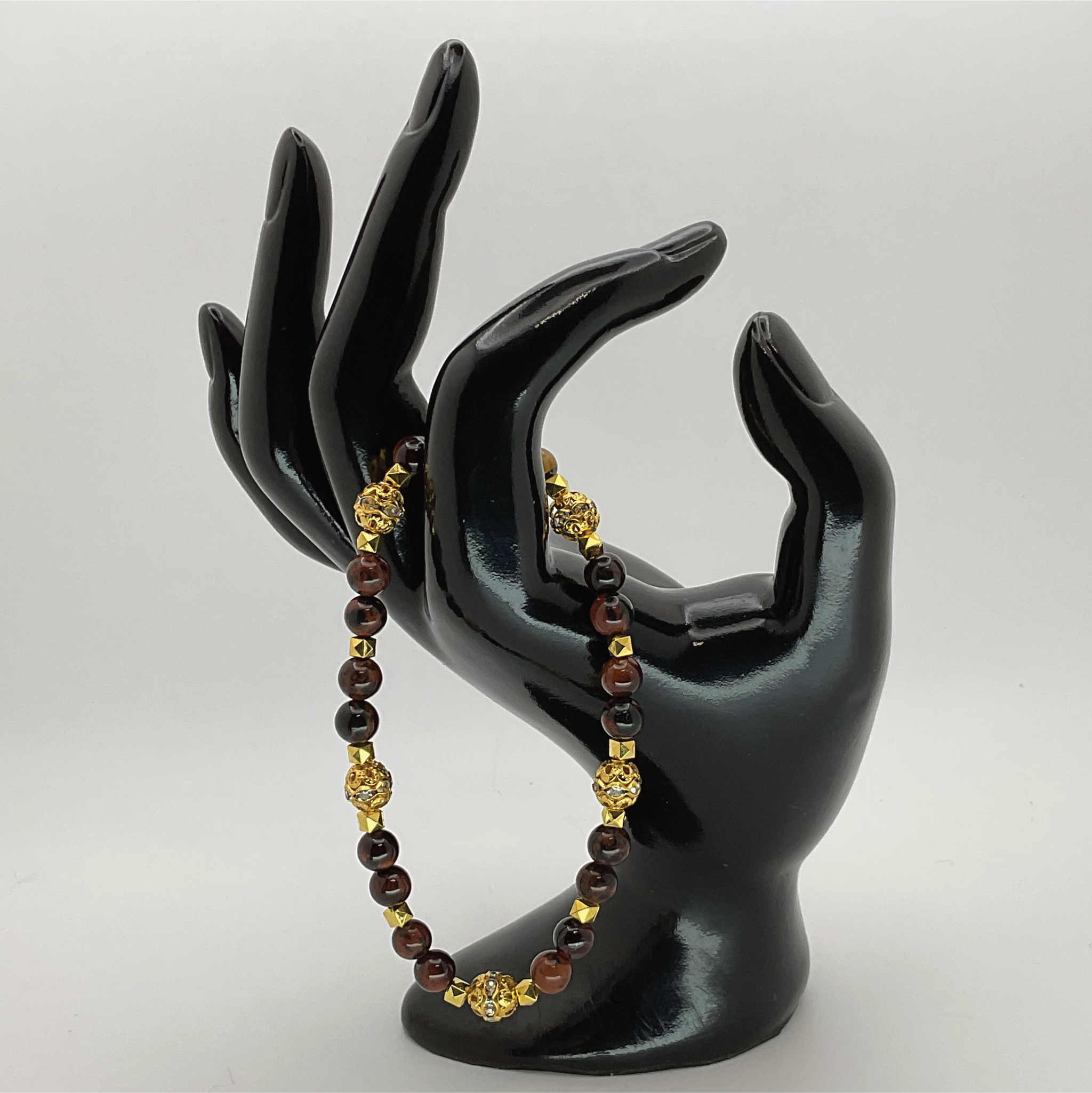 Pulsera de obsidiana caoba con espaciadores dorados