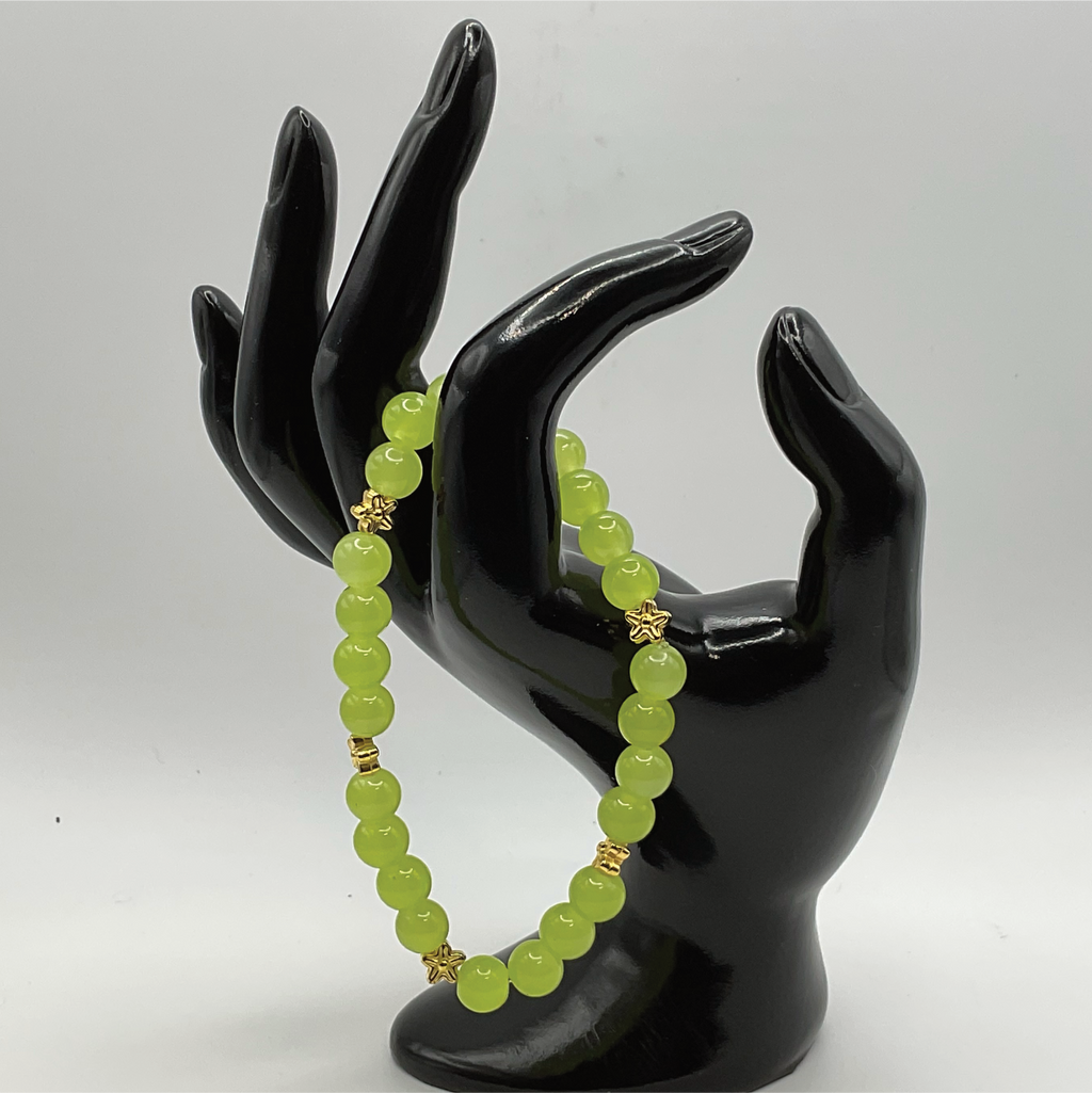Pulsera de Cristal Verde Amarillento con Separadores de Estrellas Doradas