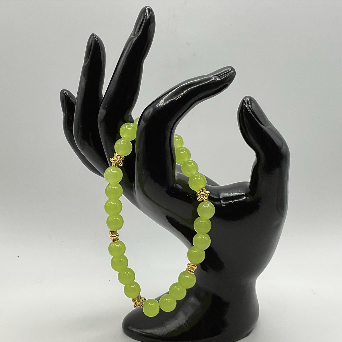 Yellowish Green Glass Bracelet with Gold Star Spacers