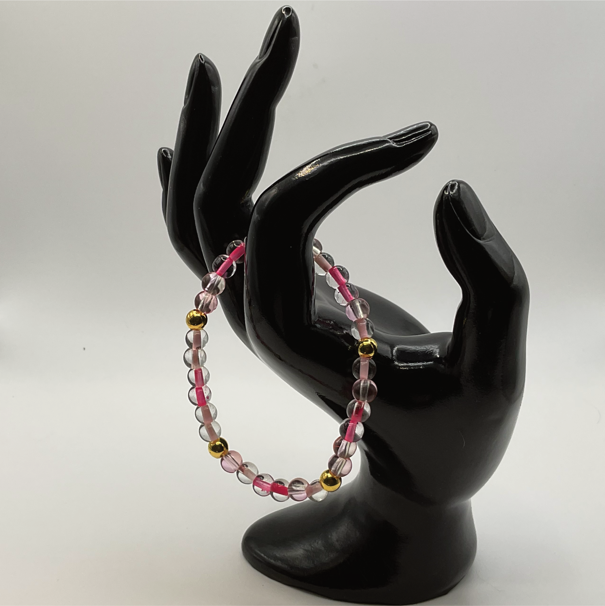 Clear Lined Pink Glass Bracelet with Gold Spacers