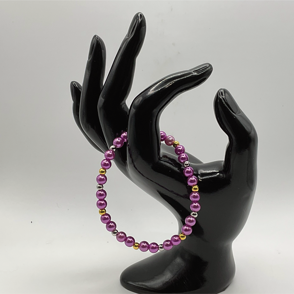 Pulsera de cristal morado con separadores dorados y plateados