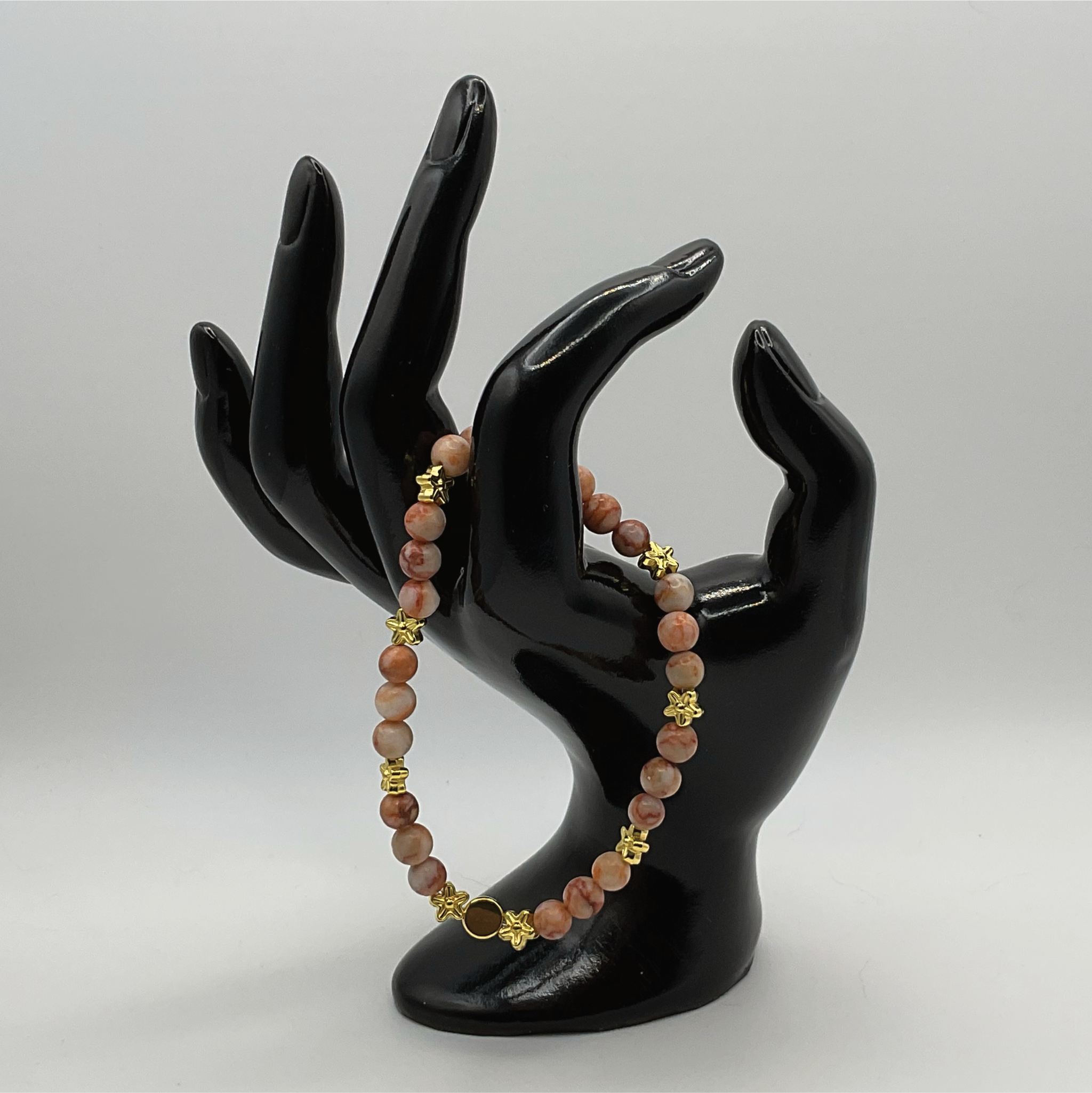 Red Vein Jasper Bracelet with Gold Tone Star and Disc Spacers