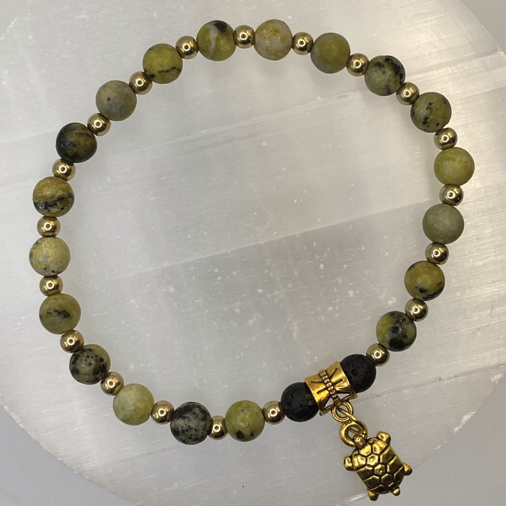 Serpentine Lava Turtle Charm Bracelet with Gold Tone Spacers
