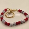 Correa de teléfono de howlite blanco y rojo