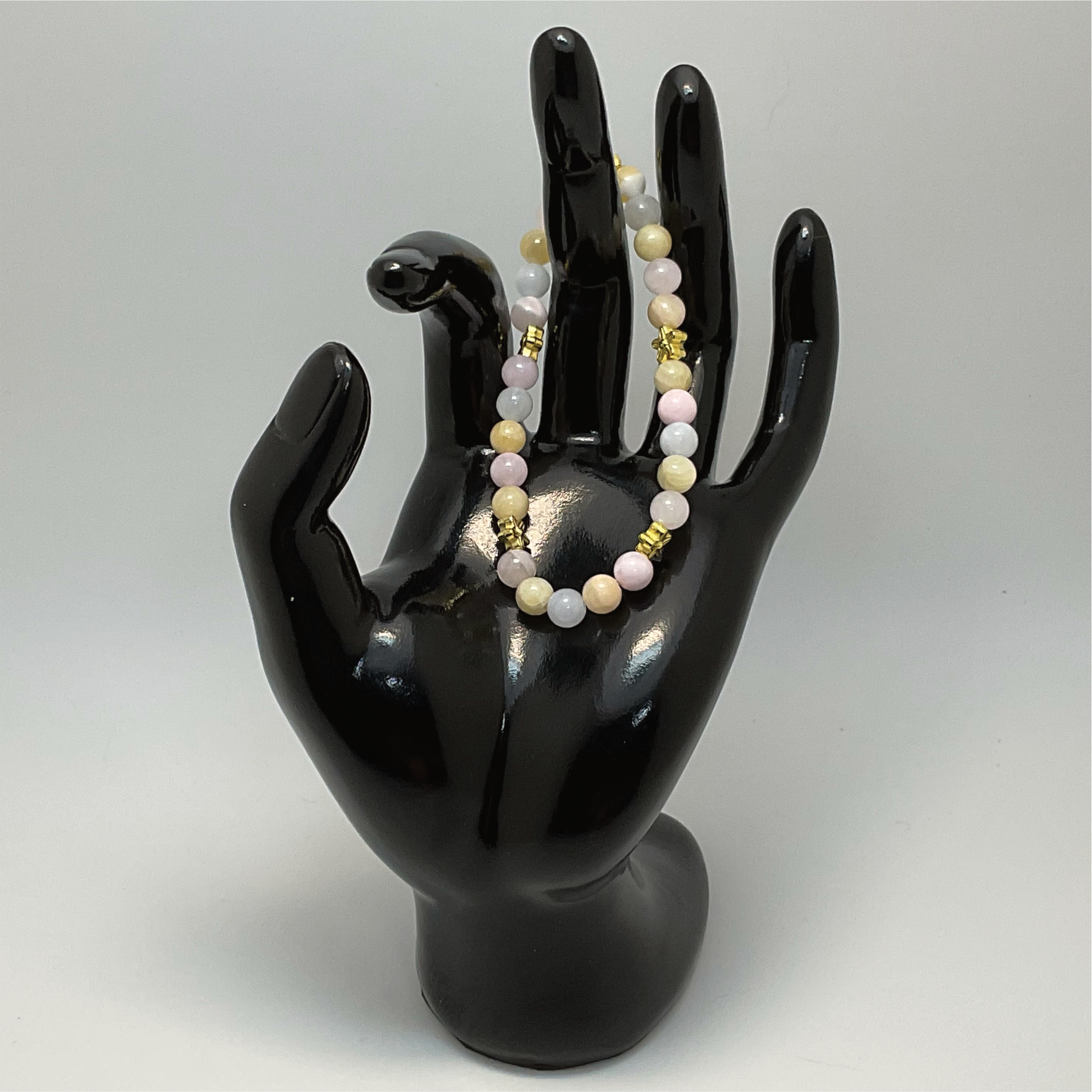 Pulsera de ópalo rosa, cuarzo lechoso y citrino con espaciadores de estrella dorados