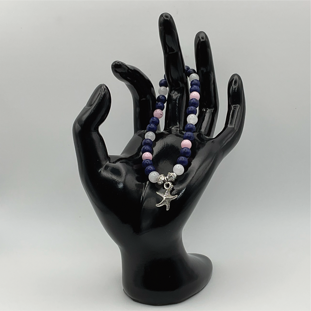 Pulsera de cuarzo rosa sodalita y cuarzo lechoso con dije de estrella de mar