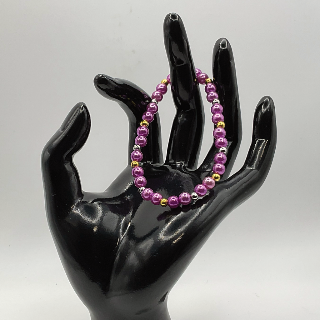Pulsera de cristal morado con separadores dorados y plateados