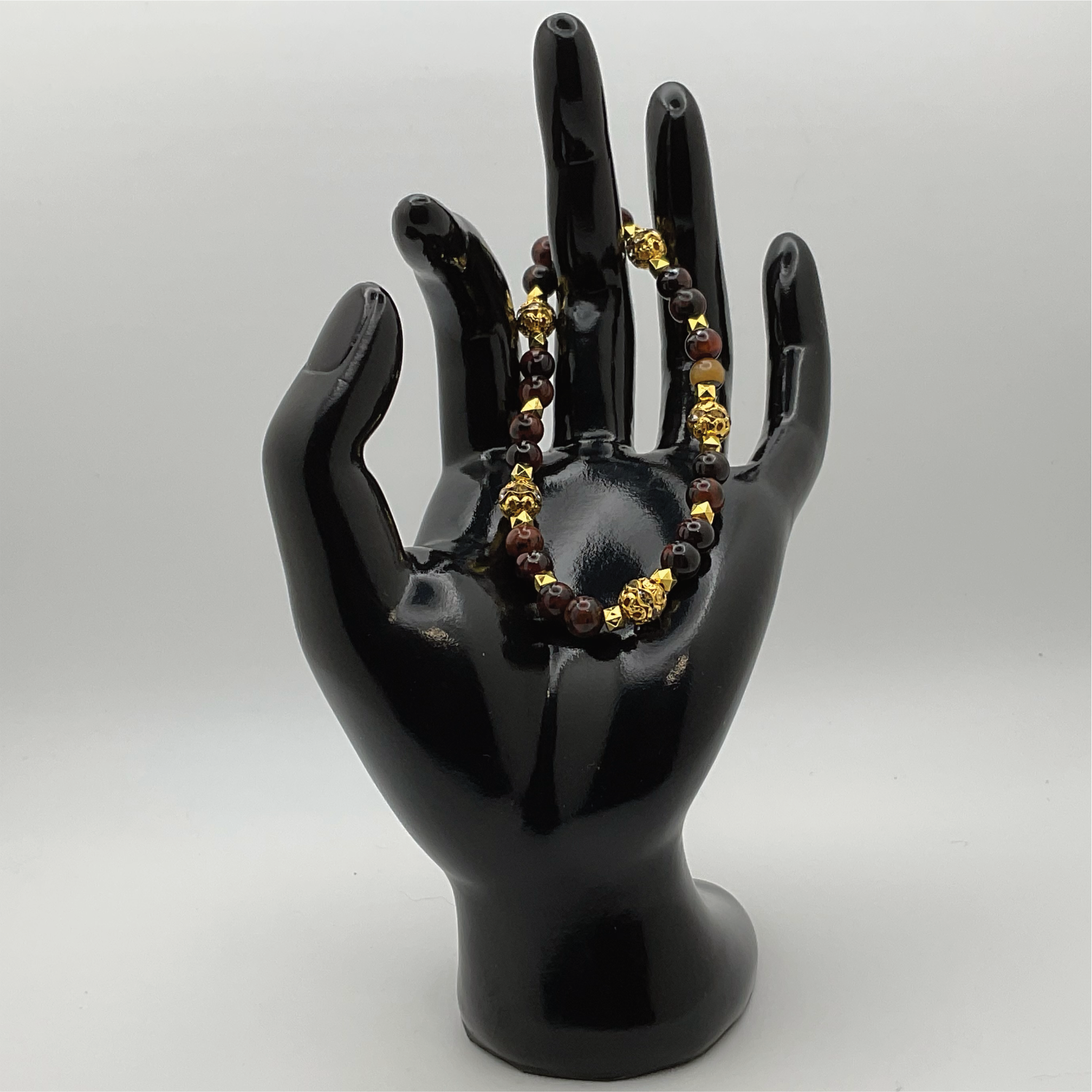 Pulsera de obsidiana caoba con espaciadores dorados