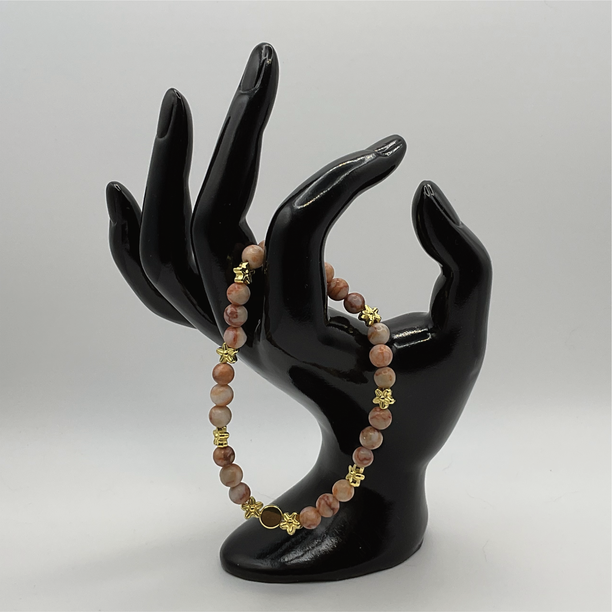 Red Vein Jasper Bracelet with Gold Tone Star and Disc Spacers