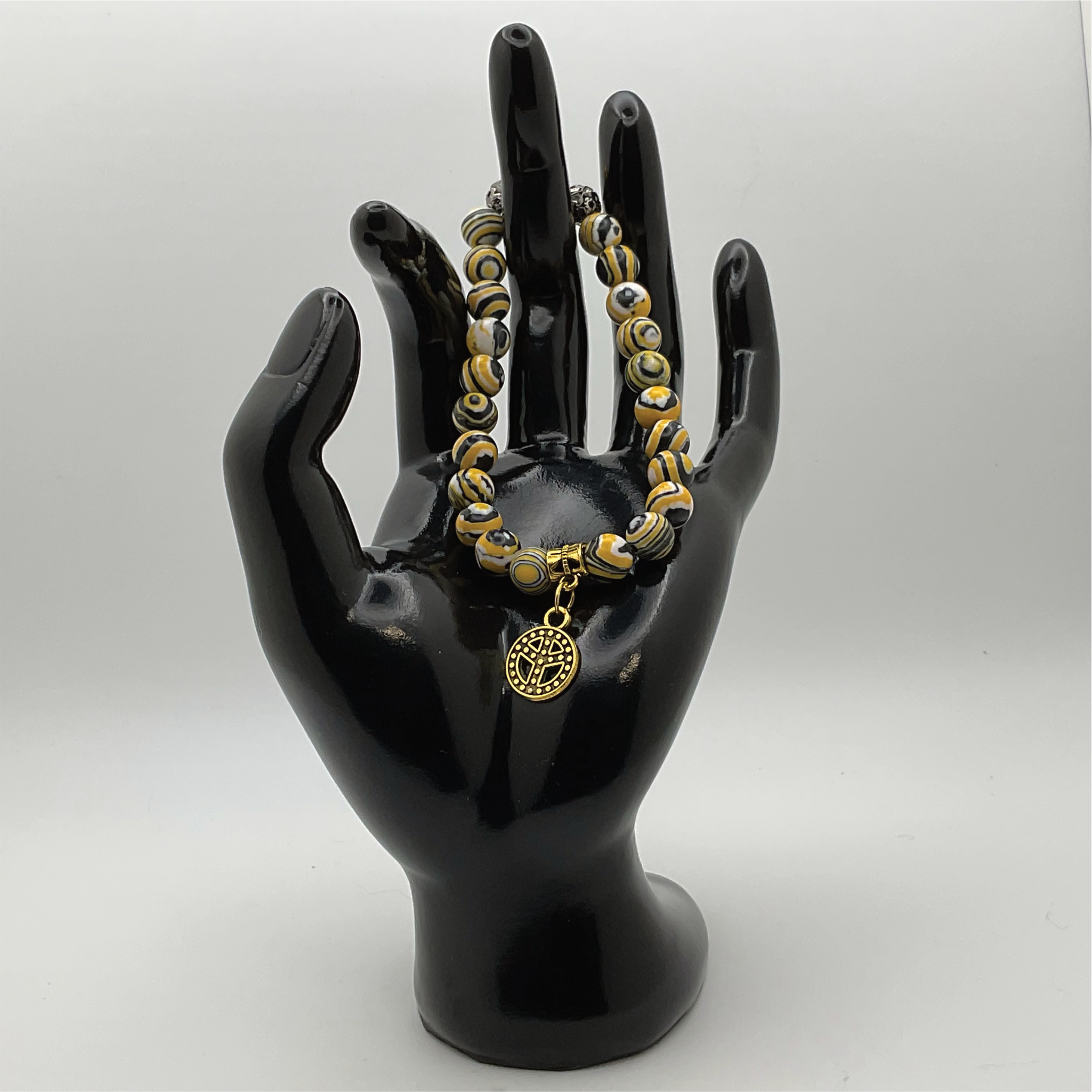 Pulsera de cuentas de jaspe abejorro con espaciadores dorados y negros