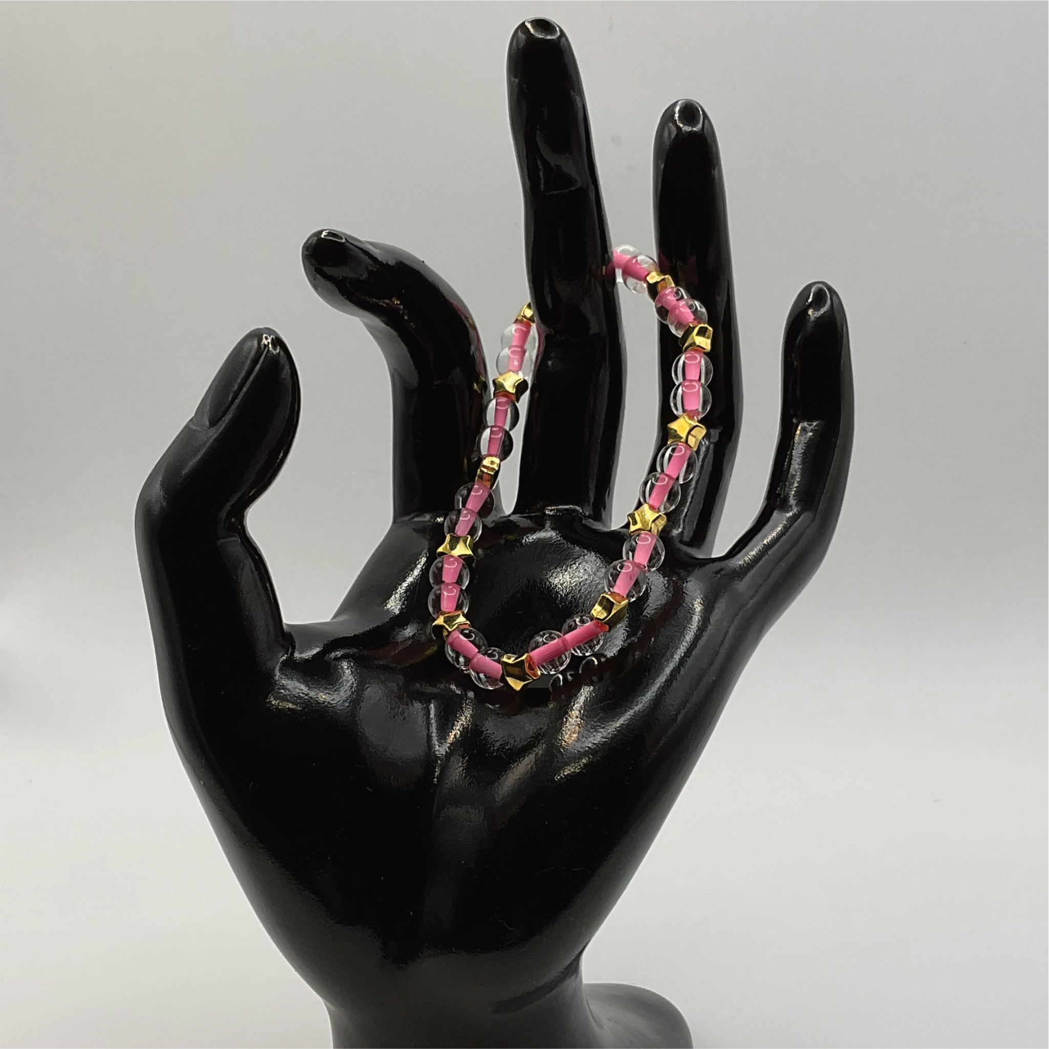 Clear Lined Pink Glass Bracelet with Gold Star Spacers