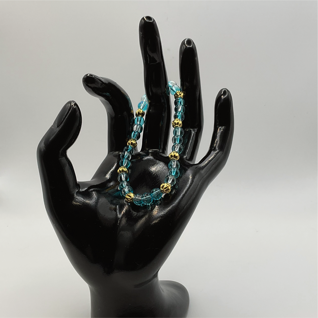 Clear Blue Glass Bracelet with Gold Lobed Spacers