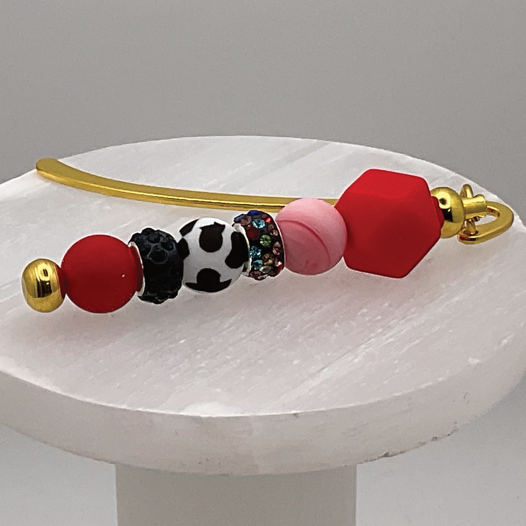 Marcador con estampado de vaca roja